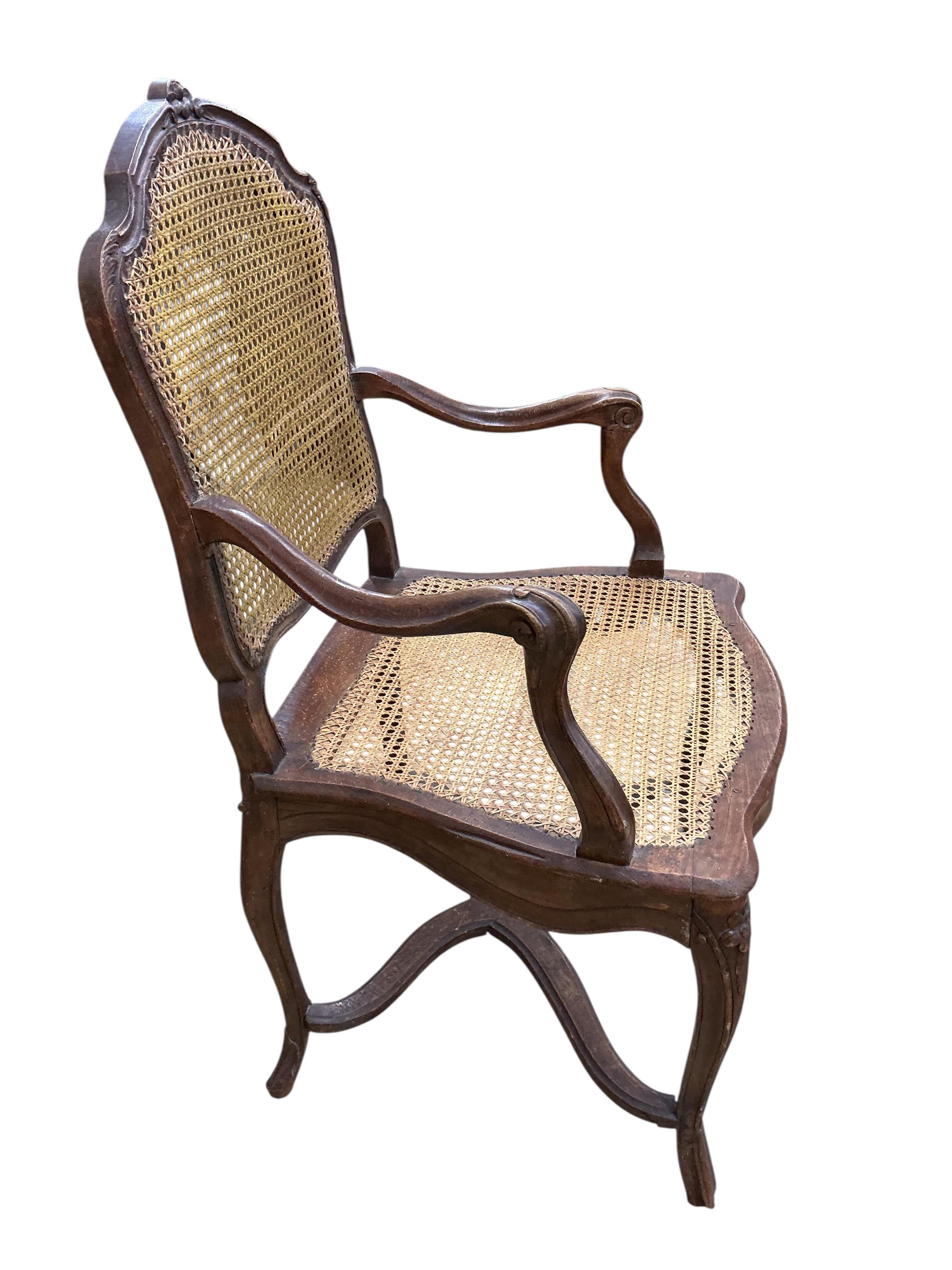 A 19th century French caned beech elbow chair, width 60cm, depth 48cm, height 90cm